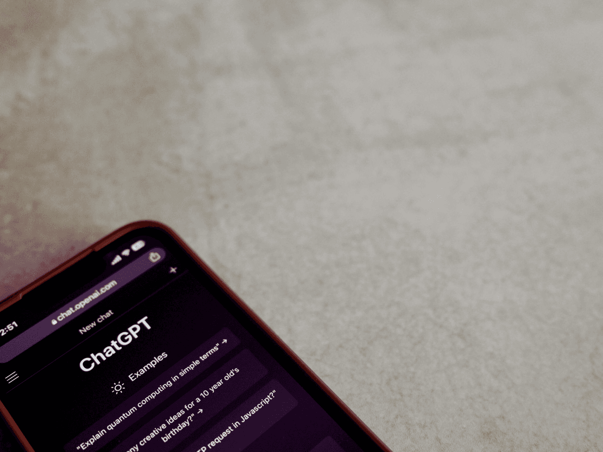 Smartphone displaying ChatGPT AI interface representing artificial intelligence in communication and content strategy